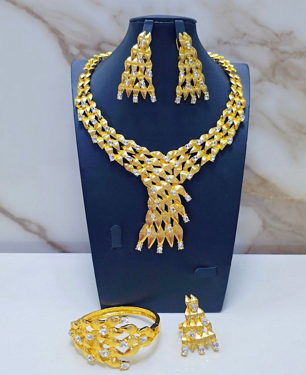 Non Tanish gold replica costume necklace set.