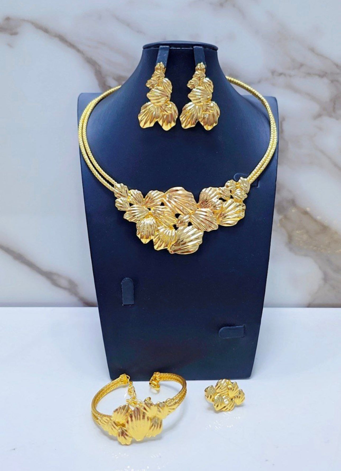 Non Tanish gold replica costume necklace set.
